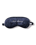 The Petite Plume Adults Silk Just Married Sleep Mask in Navy, with Just Married embroidered in white cursive, makes a perfect gift for newlyweds.