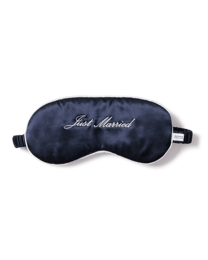 The Petite Plume Adults Silk Just Married Sleep Mask in Navy, with Just Married embroidered in white cursive, makes a perfect gift for newlyweds.