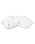 The Adults Twill Sleep Mask in Bateau by Petite Plume is a white mask with light blue trim and colorful sailboat designs. It has an adjustable strap for a luxurious sleep experience and makes a perfect monogrammed gift for those who appreciate elegance at bedtime.