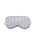 The Adults Twill Sleep Mask in Navy French Ticking by Petite Plume features white and navy stripes, black edges, and an elastic strap. Ideal for a luxury sleep experience, its perfect for monogrammed gifting to someone special.