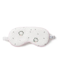 The Petite Plume Adults Twill Sleep Mask in Somerset Wreath features white twill, embroidered green and pink wreaths, black stitching, a white elastic strap, soft pink trim, and a PETITE tag—perfect for matching or gifting.
