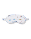 The Adult’s Twill Sleep Mask in Summer Nostalgia is a white mask with blue trim, featuring colorful beach-themed illustrations such as surfboards, boats, a jeep, and palm trees. It includes an elastic strap for a secure fit.