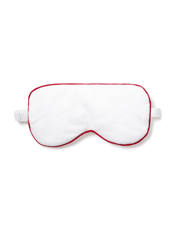 The Petite Plume Adults Twill Sleep Mask in White with Red Piping, elegantly displayed on a white background, features an elastic strap. Its perfect for those looking for matching eye masks or a special monogrammed gift.