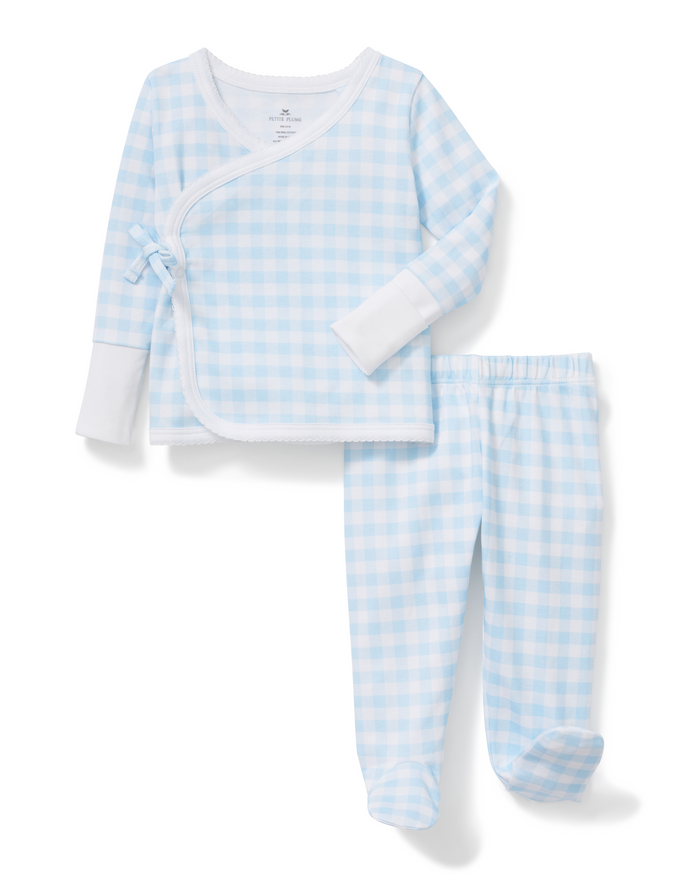 Baby Pima Wrap Set in Light Blue Gingham featuring a light blue and white check pattern, long sleeves with solid white cuffs, side tie closure, and matching pants. Displayed laid flat on a white background.