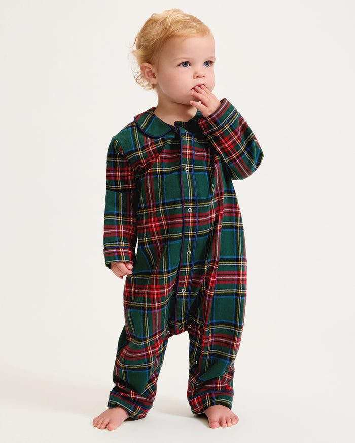 The Baby's Brushed Twill Cambridge Romper in Kensington Tartan features long sleeves, full length, a green, red, and blue plaid design, front zipper, leg snap buttons, and a rounded collar.