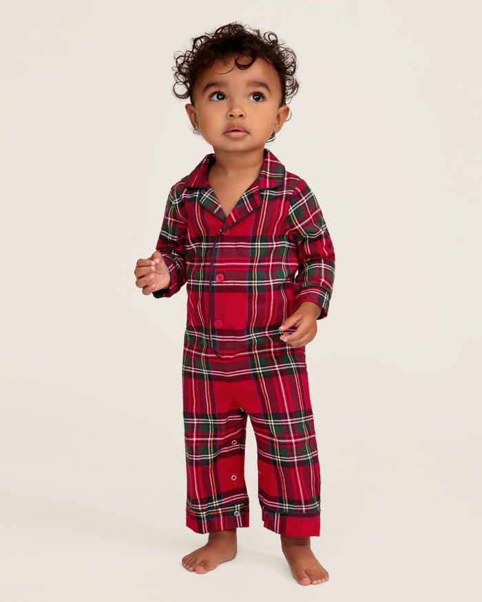 The Baby's Brushed Twill Classic Romper in Imperial Tartan features long sleeves, a collar, button front, and snap leg closures for easy diaper changes. Showcased on a white background, it has a red base with green, white, and yellow stripes.