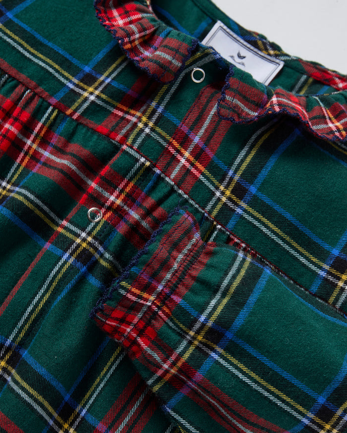 The Baby's Brushed Twill Madeline Romper in Kensington Tartan features a green, red, and yellow plaid print, ruffled collar, button front, and gathered cuffs at the wrists and ankles.