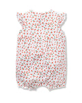 The Babys Pima Isla Play Romper in Cherry Orchard by Petite Plume is made from soft Pima cotton featuring short, ruffled sleeves and elastic leg openings. The cherry print with green leaves adds a playful touch, perfect for mom-and-me dressing.
