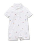 White baby romper with sailboat pattern on a white background