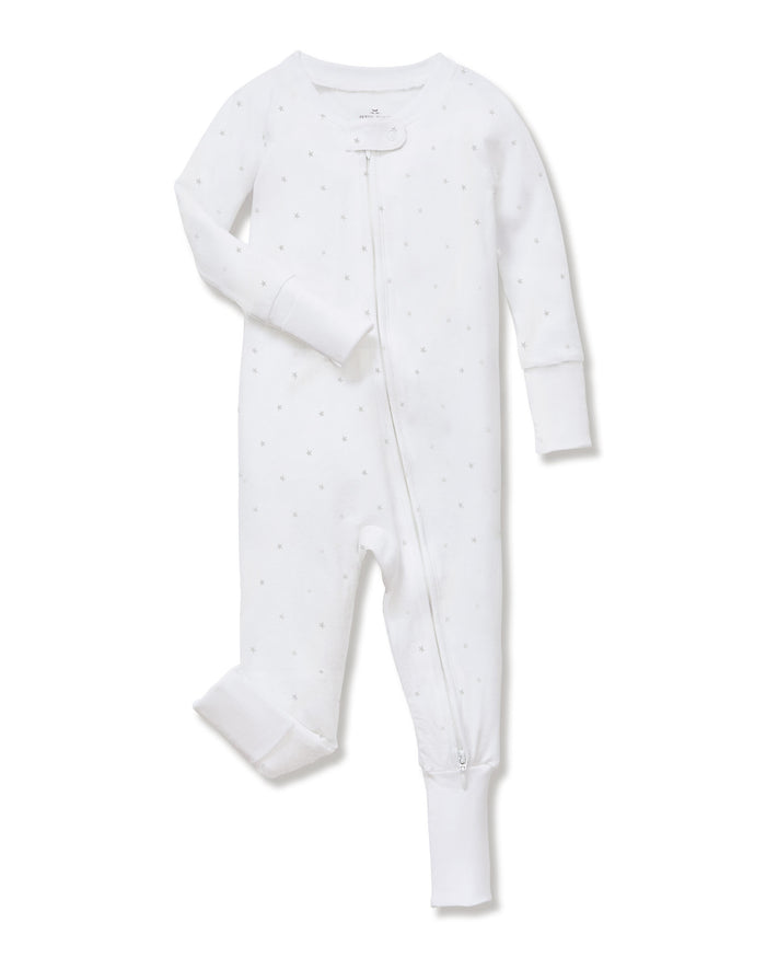 The Baby's Pima Peekaboo Romper in Grey Stars is a white onesie with long sleeves and legs, decorated with small grey stars and designed with a diagonal zipper from the neckline to the left ankle.