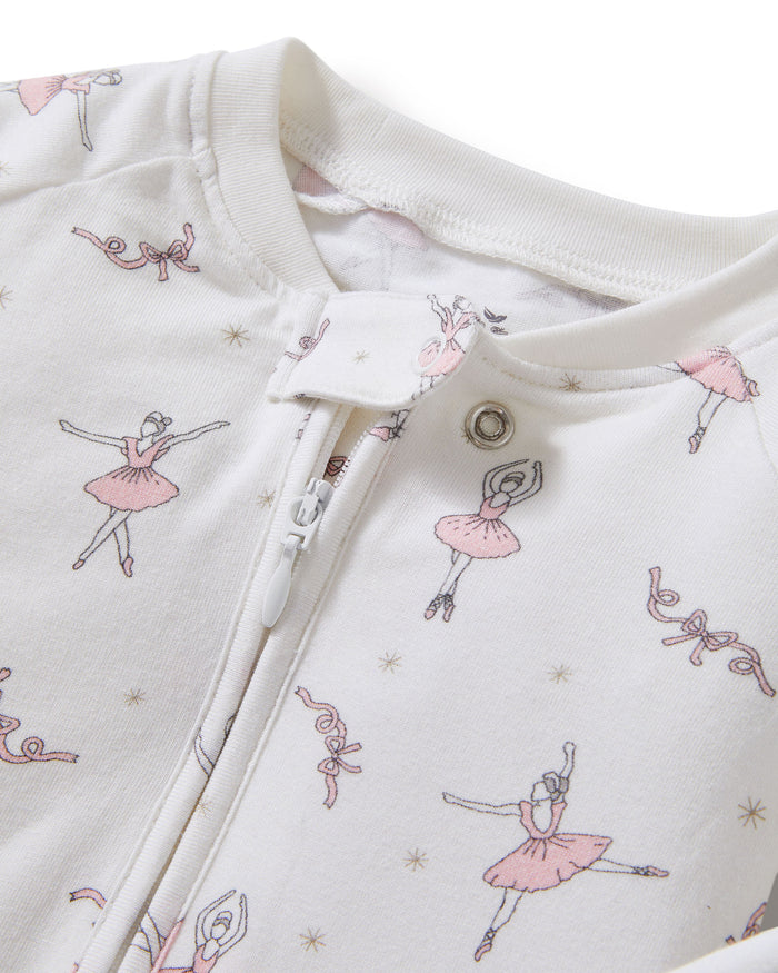 The Baby's Pima Peekaboo Romper in Sugar Plum Fairy is a long-sleeve white onesie featuring a front zipper, pink ballerina and flower prints, plus solid white cuffs and ankles.