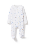 Baby’s Pima Romper in Letters and Lullabies, a white footed onesie with long sleeves, features adorable animal prints and small colorful letters, showcased on a plain white background.