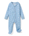 The Baby's Pima Romper in Periwinkle Wonderland is a light blue onesie with long sleeves, covered feet, white snowflake pattern, diagonal zipper from neckline to left ankle, and a small fabric snap at the neck.