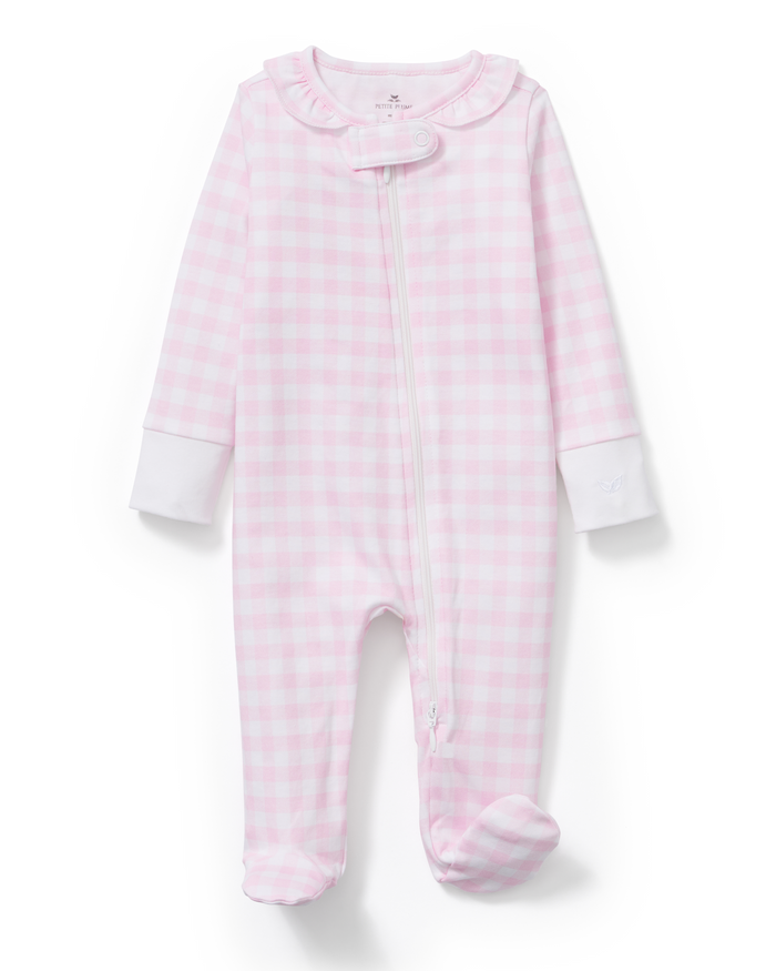 Baby’s Pima Ruffle Collar Romper in Pink Gingham features a pink and white gingham pattern, long sleeves, footed legs, white cuffs, a ruffled collar, and a diagonal zipper from the neck to the leg.
