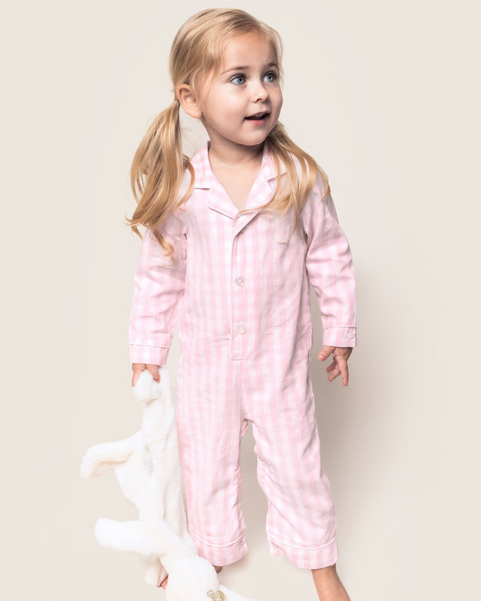 Baby's Twill Classic Romper in Pink Gingham: long sleeves, small collar, button front, footless legs. Light pink and white checkered design. Garment shown flat on a white background.
