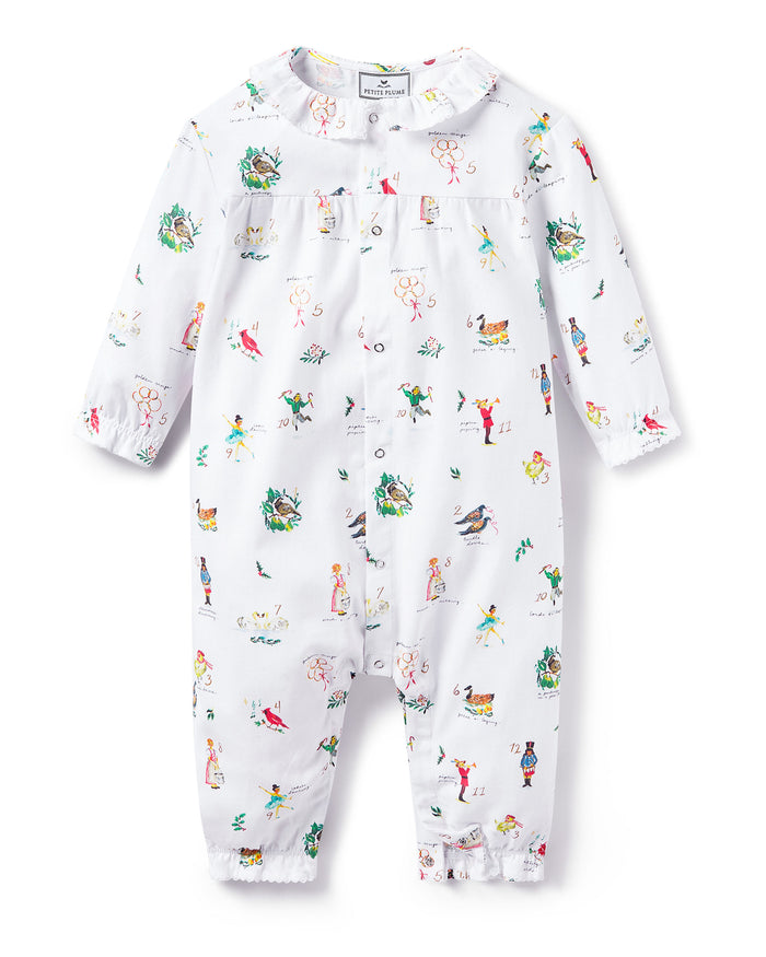 Baby's Twill Madeline Romper in 12 Days of Christmas: a white long-sleeve romper featuring colorful festive prints, a button-down front, and ruffled collar and cuffs.