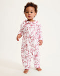 The Baby's Twill Madeline Romper in Red Timeless Toile features long sleeves, a ruffled collar, red floral print, and snap buttons down the front and legs.