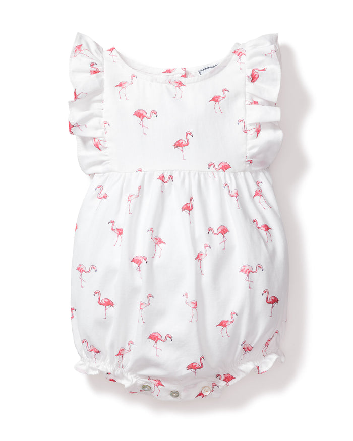 The Petite Plume Babys Twill Ruffled Romper in Flamingos combines luxury and tropical flair with its playful pink flamingo print, ruffled sleeves, and convenient bottom snaps for easy changing.