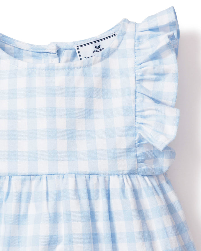 Baby's Twill Ruffled Romper in Light Blue Gingham features ruffled sleeves, a gathered waist, and bottom snap buttons for easy diaper changes, shown on a white background.