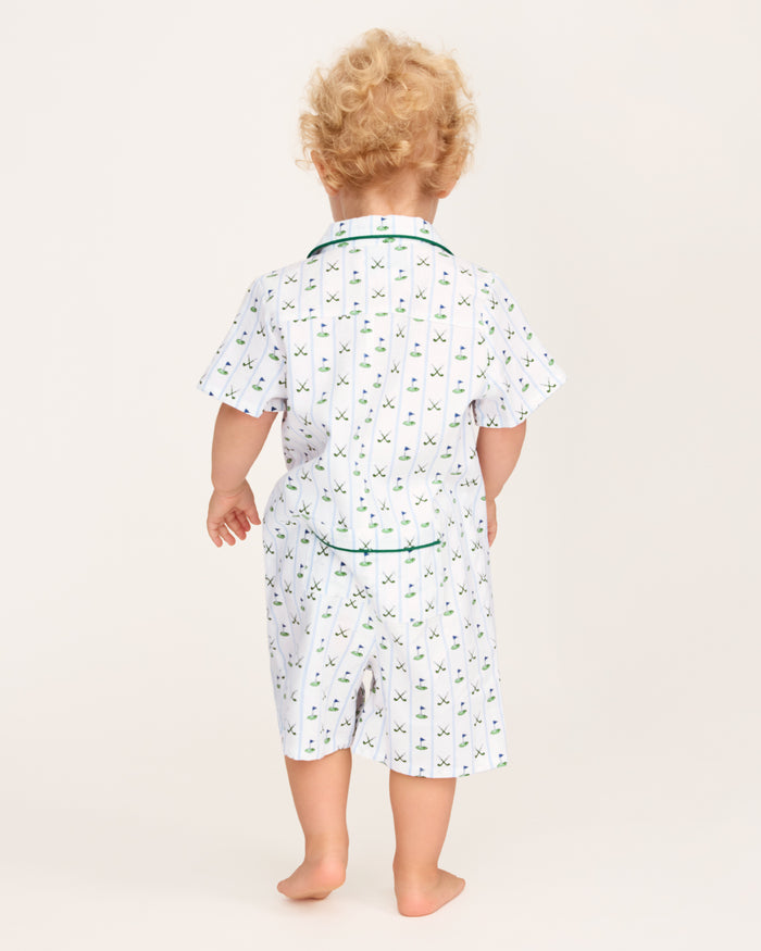 The Baby's Twill Summer Romper in Fairway Stripe is a short-sleeved, button-down romper with green piping, decorated with golf clubs and holes on white fabric with blue vertical stripes.