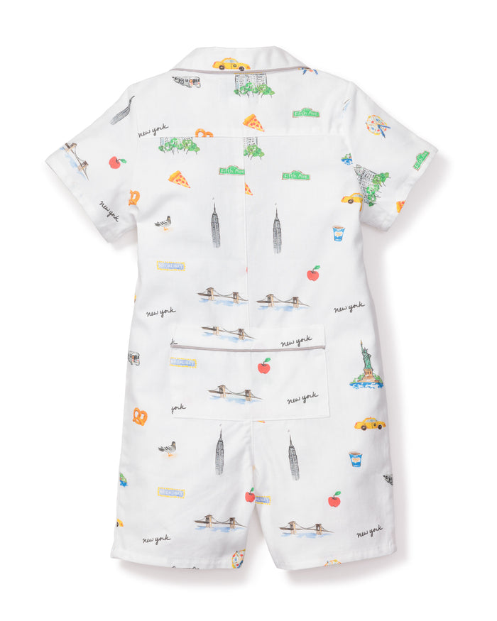 The Babys Twill Summer Romper by Petite Plume features New York-themed illustrations, like pizza and the Statue of Liberty, yarn-dyed cotton fabric, New York text, short sleeves, and shorts.