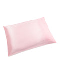 The Colony Hotel x Petite Plume Silk Pillow Cover in Pink offers a soft, luxurious feel with its light pink pure silk and smooth, shiny texture, evoking the elegance of the Colony Hotel. Presented against a plain white background.