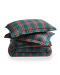 The Flannel Duvet Set in Kensington Tartan features a green, red, and white plaid pattern and includes a comforter and two pillows, all neatly folded against a white background.