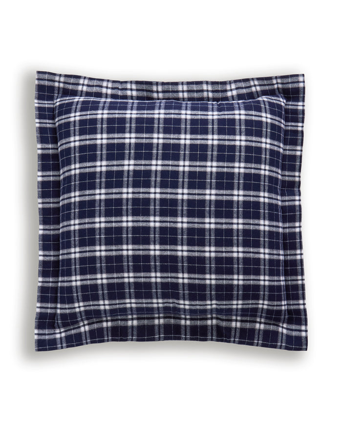 The Flannel Euro Sham in Oxford Tartan features a rectangular shape and a navy blue and white plaid checkerboard pattern set against a crisp white background.