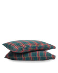 Two Flannel Pillow Cases in Kensington Tartan, featuring a green, red, and yellow plaid pattern, are stacked against a white background.