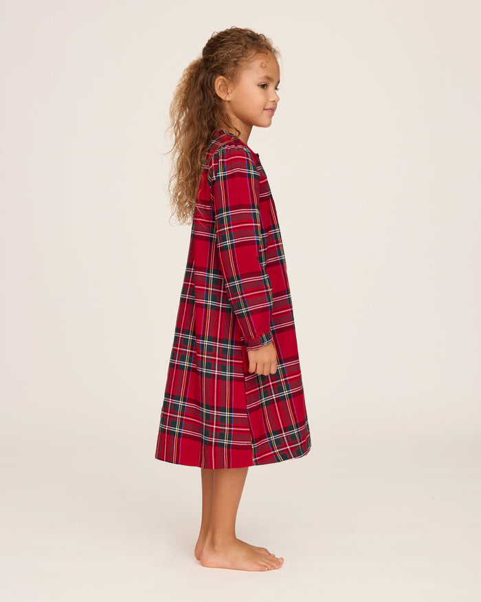 The Girl's Brushed Twill Beatrice Nightgown in Imperial Tartan is a long-sleeved, knee-length nightgown with a red, green, black, and white plaid, partial front buttons, and gentle shoulder gathers.