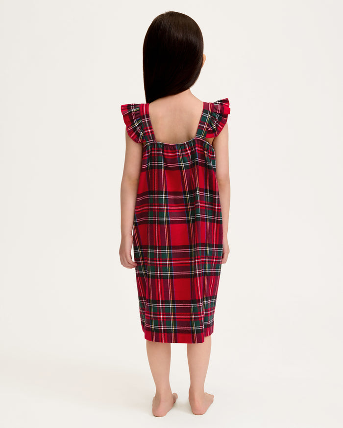 The Girl's Brushed Twill Clara Nightgown in Imperial Tartan is a sleeveless, knee-length nightgown with red, green, and white plaid, ruffled shoulder straps, and a gathered waist, shown against a white background.