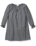 The Girls Flannel Delphine Nightgown in Grey by Petite Plume is a gray, long-sleeved nightgown with a round neckline and front keyhole detail. It features ruffled cuffs and subtly textured brushed cotton flannel, making it perfect for cozy nights as chemical-free sleepwear.