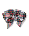 The Petite Plume Girls Hair Bow in Balmoral Tartan showcases red, green, blue, pink, and white stripes with neat loops and tails on a plain white background—an ideal holiday gift.