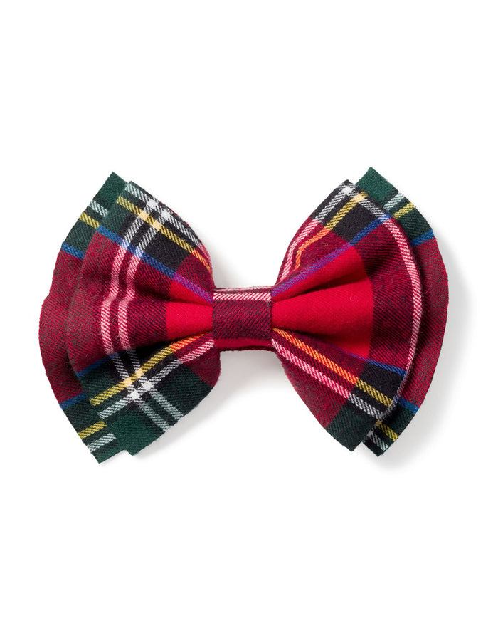 A beautifully arranged Petite Plume Girls Hair Bow in Imperial Tartan lies on a white background, featuring red plaid with green, yellow, and blue stripes. Its soft texture and timeless design make this an ideal holiday gift or charming stocking stuffer for any occasion.