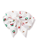 Petite Plumes Girls Hair Bows in Winter Nostalgia features a large white bow with festive patterns like red cars, Christmas wreaths, stockings, and candy canes, making it an ideal holiday gift or stocking stuffer for girls who adore cheerful designs.