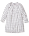The Girls Twill Delphine Nightgown in Regent Tattersall by Petite Plume is a knee-length, long-sleeved dress with a gray and white checkered pattern. Made from yarn-dyed cotton, it has a round neckline with a keyhole opening and ruffled cuffs. The soft, lightweight fabric is ideal for casual wear.