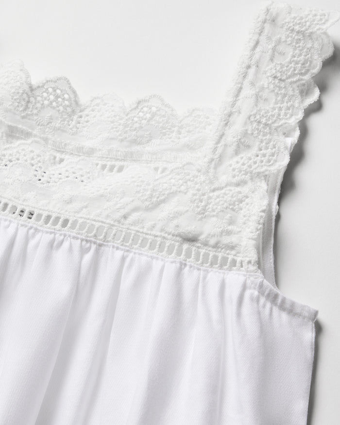 Close-up of the Girls Twill Esme Nightgown in White by Petite Plume, showcasing intricate lace detailing on the straps and neckline, crafted from yarn-dyed cotton with a smooth drape.