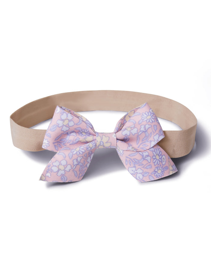 Two Girl's Twill Hair Bows in Fleur Blush, pink fabric bows with a floral pattern of white, yellow, and lavender flowers, displayed on a white background.