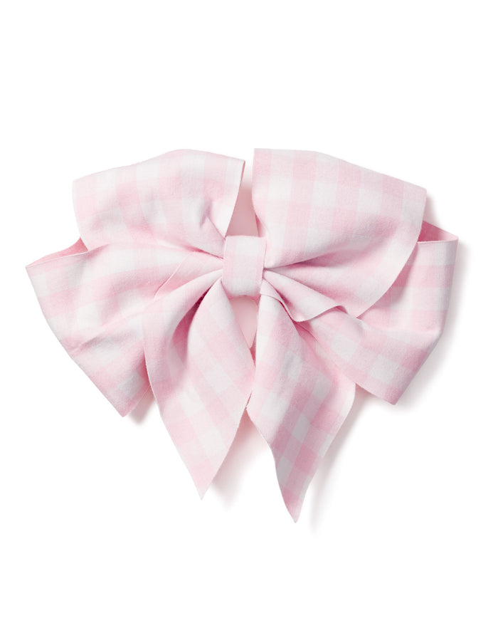 The Girls Twill Hair Bow by Petite Plume in pink gingham, featuring multiple loops and tails, is displayed on a white background, highlighting its charming fabrics as a delightful accessory.