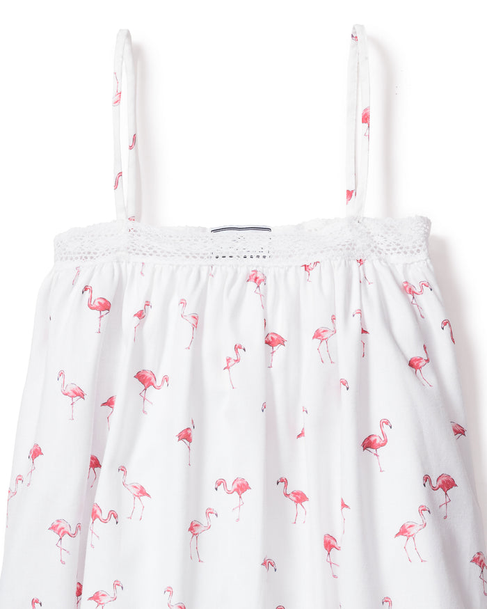 Indulge in the luxurious Girls Twill Lily Nightgown by Petite Plume. This white nightgown, adorned with thin straps and crochet trim, features playful pink flamingos for a tropical bedtime twist.