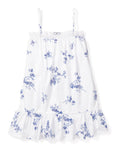 Girls Twill Lily Nightgown in Indigo Floral by Petite Plume is a white sleeveless dress with thin straps and a vintage lace nightgown style. It features blue floral print, lace trim along the neckline, and a ruffled hem.