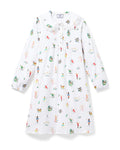 The Girl's Twill Lola Nightgown in 12 Days of Christmas is a white long-sleeve children’s dress with a Peter Pan collar and a playful pattern of colorful people, animals, and plants scattered across the fabric.