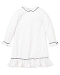 The Girls Twill Sophia Nightgown by Petite Plume is a white long-sleeve gown with navy piping on the Peter Pan collar and cuffs. Made from yarn-dyed cotton, it boasts ruffled cuffs and hem for an elegant touch, perfect for stylish sleepwear.