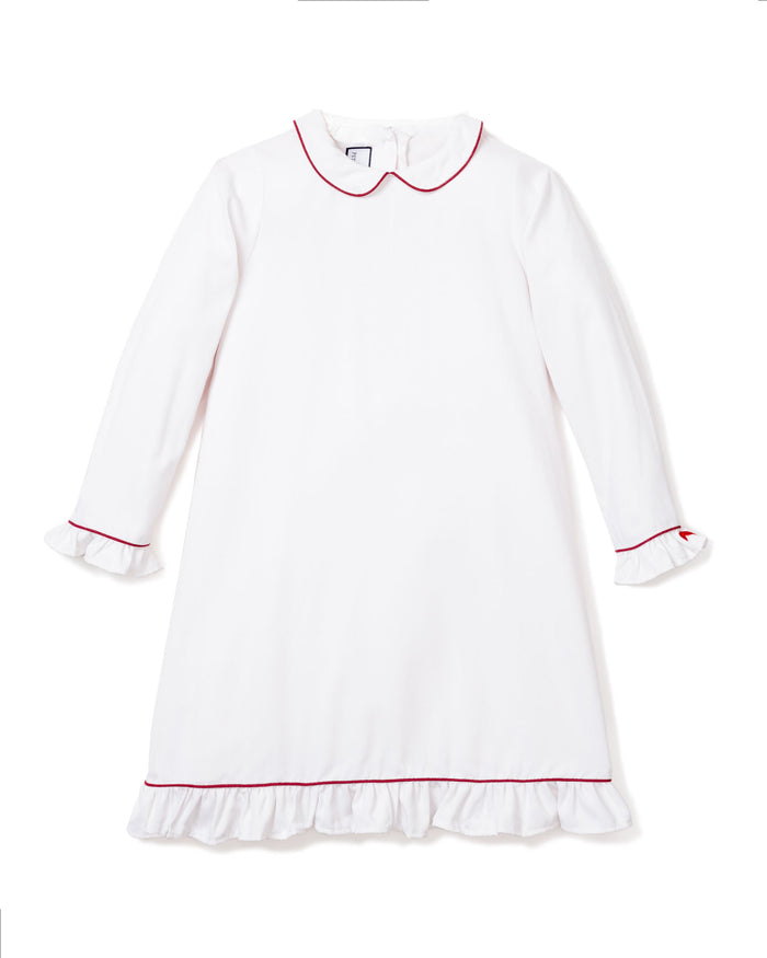 The Petite Plume Girls White Sophia Nightgown features a round collar, red piping, and ruffled trims at the cuffs and hem, made from comfortable cotton sleepwear.