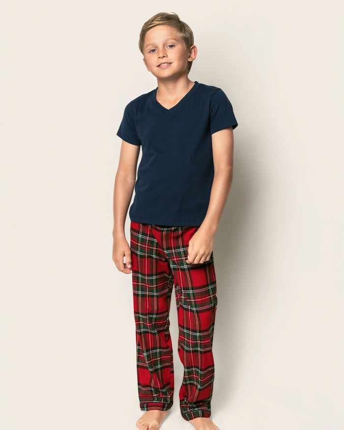 Kid's Brushed Twill Pajama Pants in Imperial Tartan laid flat on a white background, featuring red plaid with green, white, and yellow stripes, plus an elastic waistband and bottom cuffs.