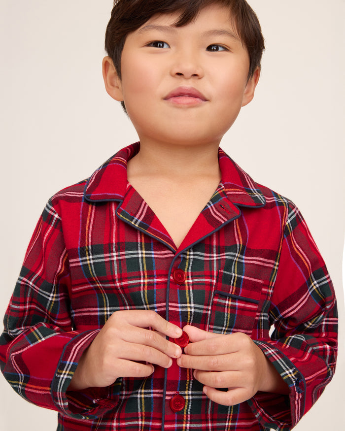 Kid's Brushed Twill Pajama Set in Imperial Tartan features a red, green, white, and black plaid design with a long-sleeve button-up top, chest pocket, collar, and matching pants.