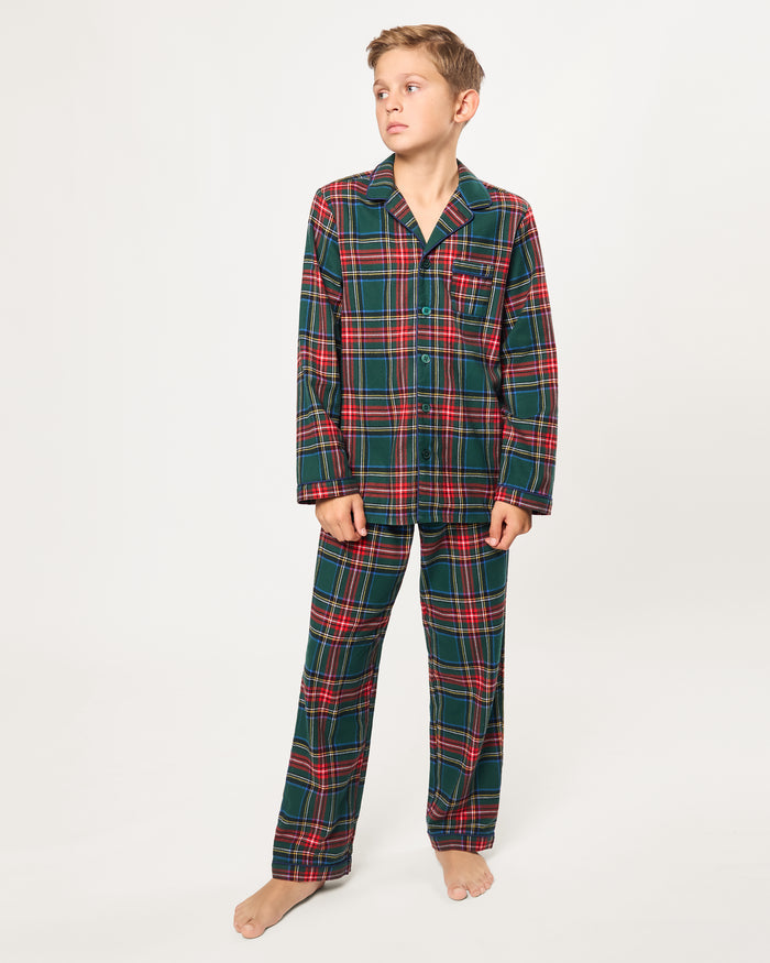 The Kid's Brushed Twill Pajama Set in Kensington Tartan, featuring a green, red, and yellow plaid button-up top with a chest pocket and matching long pants, is shown laid flat on a white background.