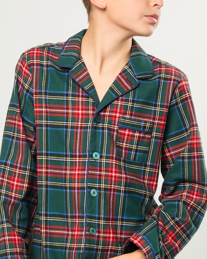 The Kid's Brushed Twill Pajama Set in Kensington Tartan, featuring a green, red, and yellow plaid button-up top with a chest pocket and matching long pants, is shown laid flat on a white background.