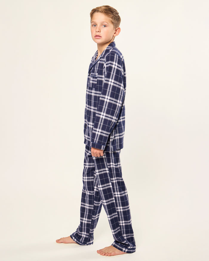 Kid's Brushed Twill Pajama Set in Oxford Tartan, featuring a navy and white plaid long-sleeve button-up top with chest pocket and matching elastic-waist pants, displayed neatly on a white background.