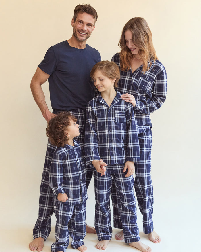 Kid's Brushed Twill Pajama Set in Oxford Tartan, featuring a navy and white plaid long-sleeve button-up top with chest pocket and matching elastic-waist pants, displayed neatly on a white background.